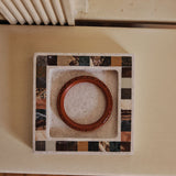 Checkerboard inlay stone tray by Anastasio Home