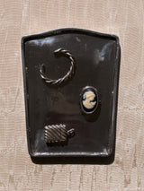 Roma Tray, a crest-shaped cast-metal catchall in brass or aluminum