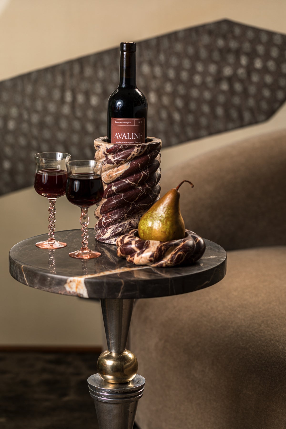 Wine Chiller and Wine Coaster in Cabernet Red Marble with Avaline red wine on a side table