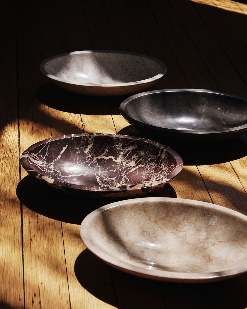 An oval carved stone bowl